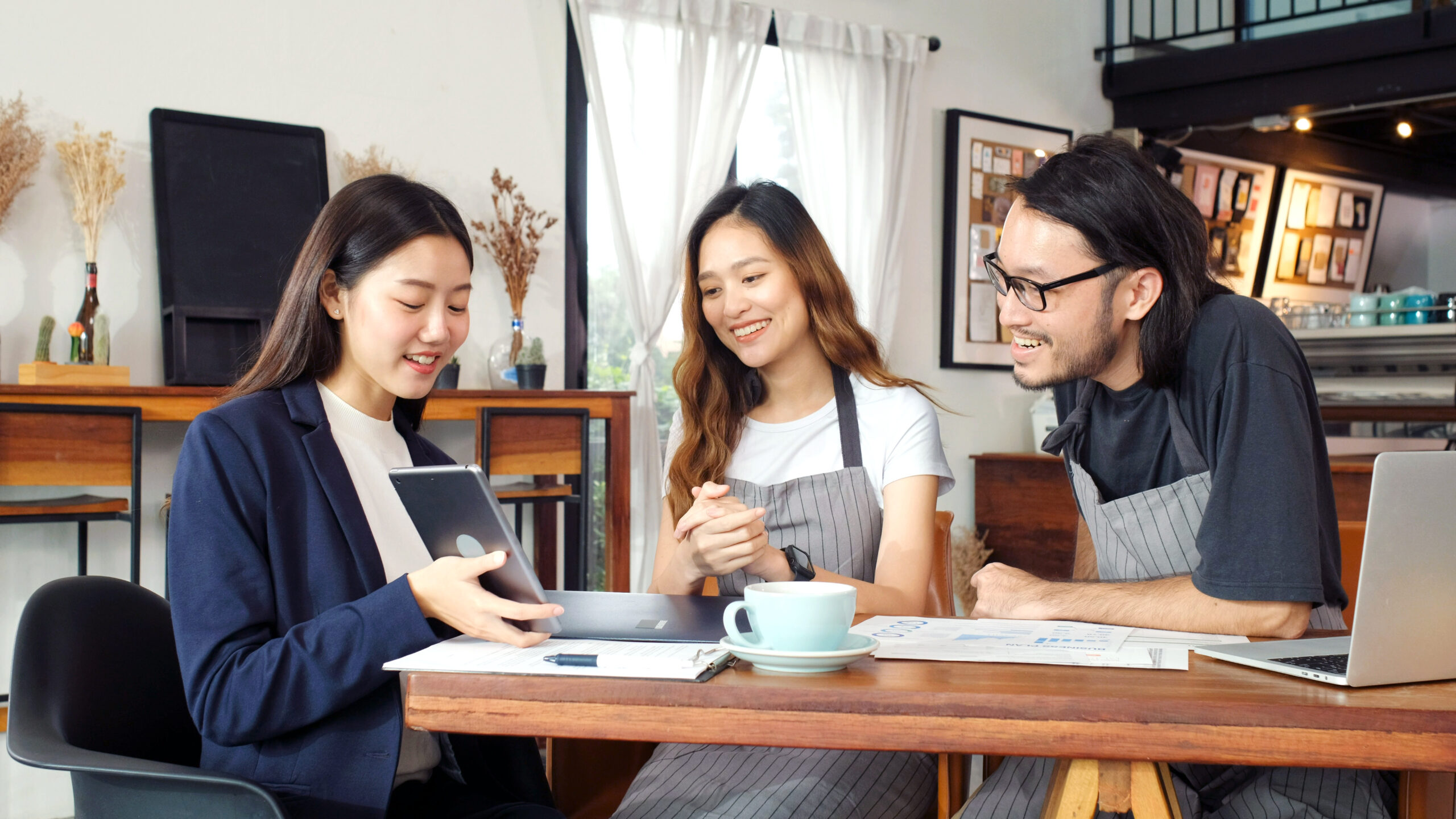 Small business owners talking at a table