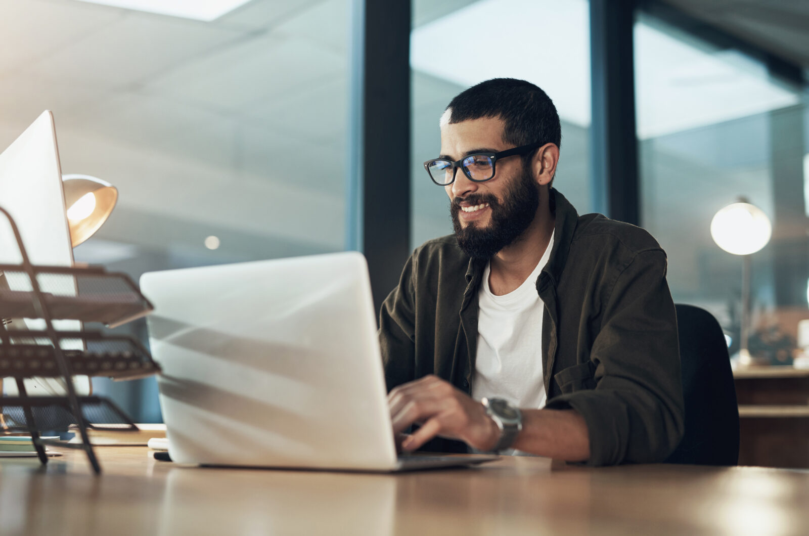 Man In Office Looking At Computer